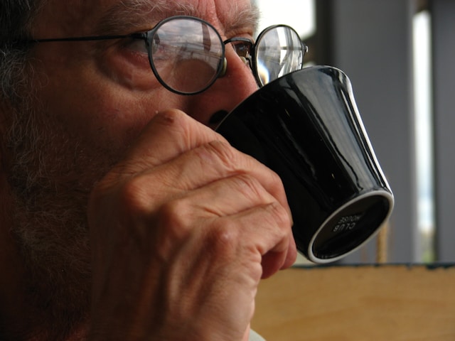 senior sipping a coffee