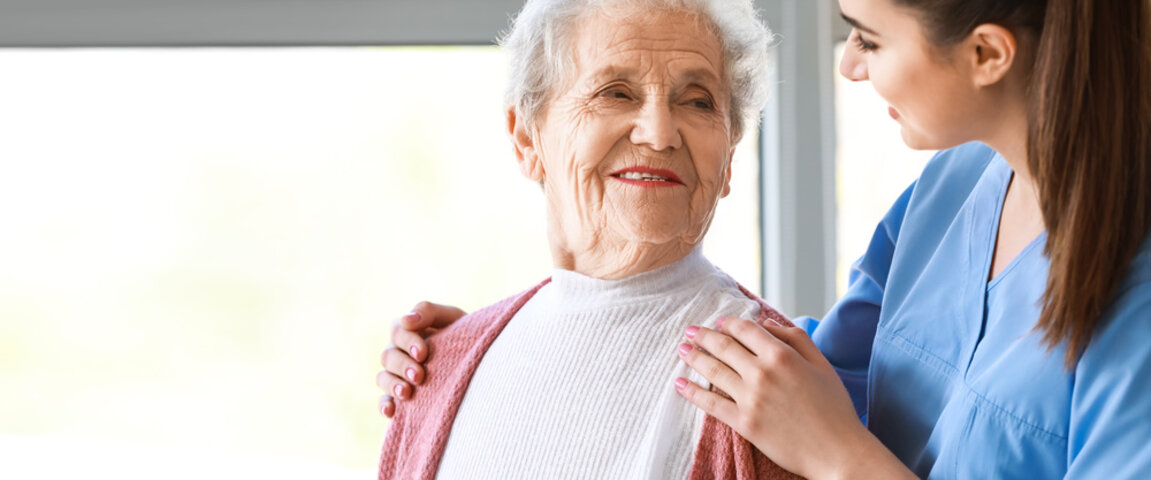 elderly person being cared for by nurse