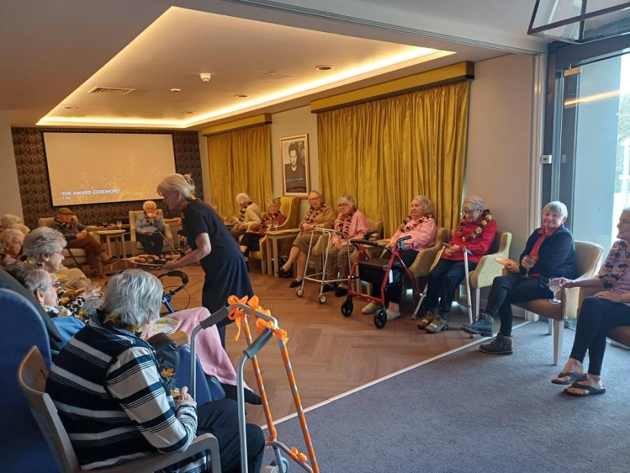 residents receiving food from home manager 