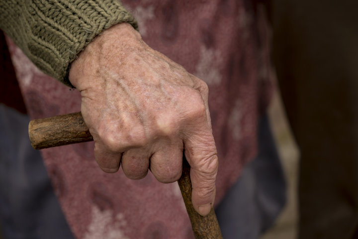old person with a stick