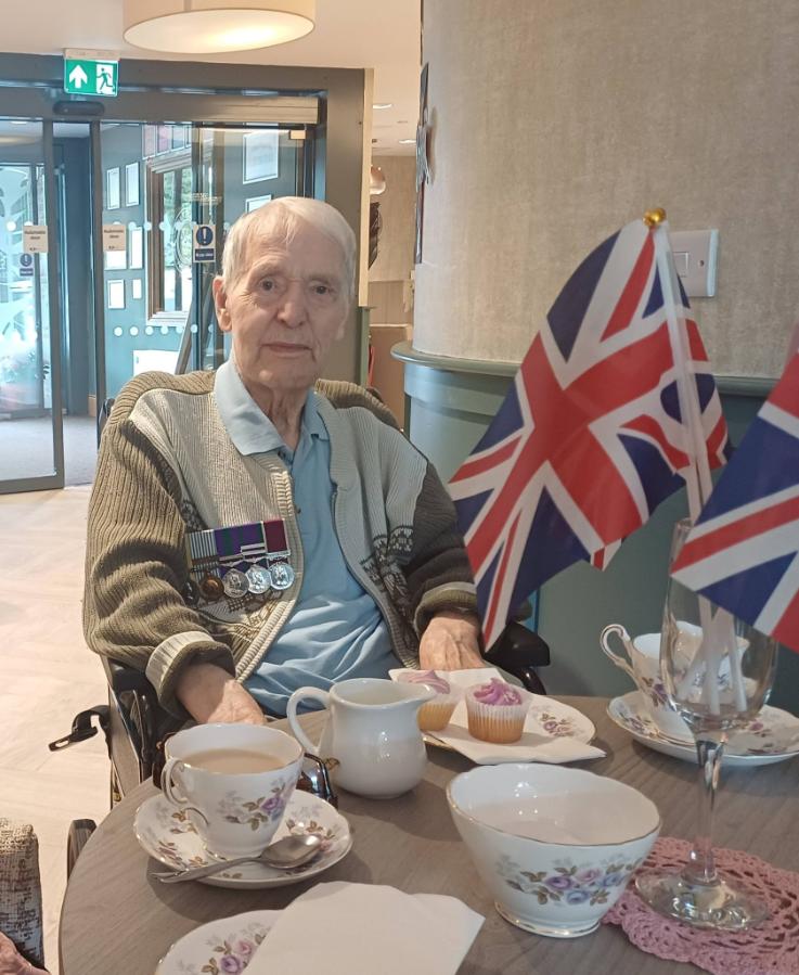 resident with his medals at VE day celebration