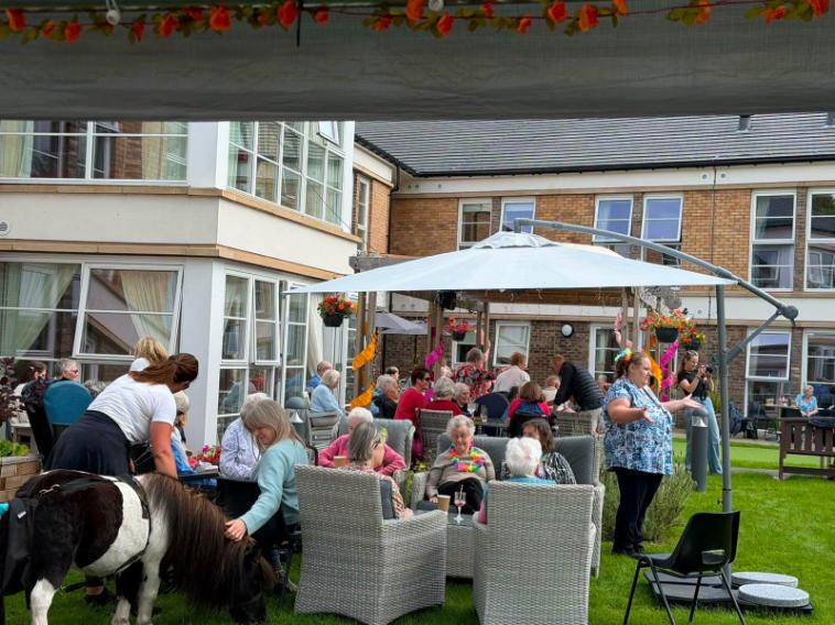 residents outside at summer bbq party